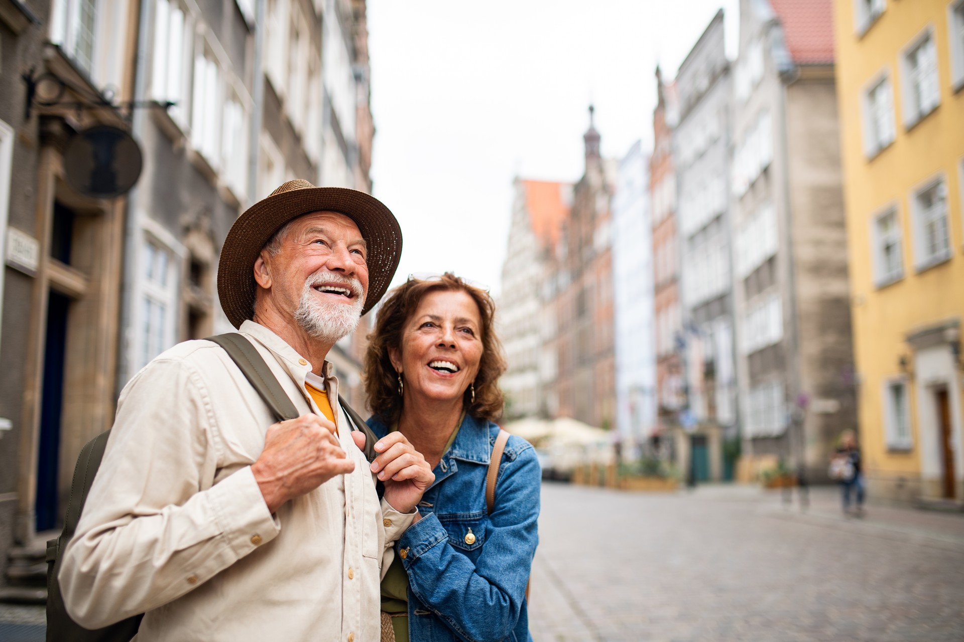 Portrait of happy senior couple tourists Athens outdoors in historic town